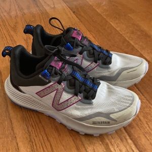 Grey new balance sneakers , all terrain. Size 8